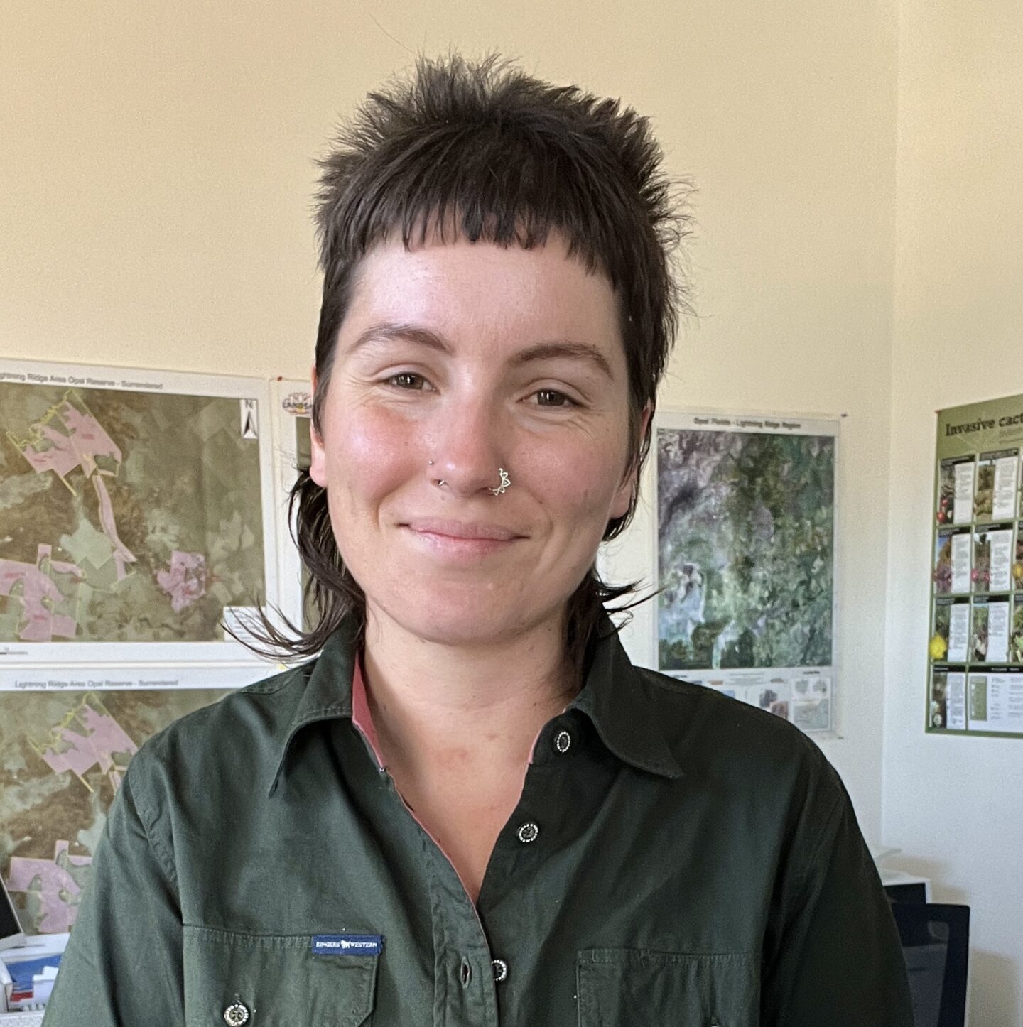 People working outdoors on land management and community programs