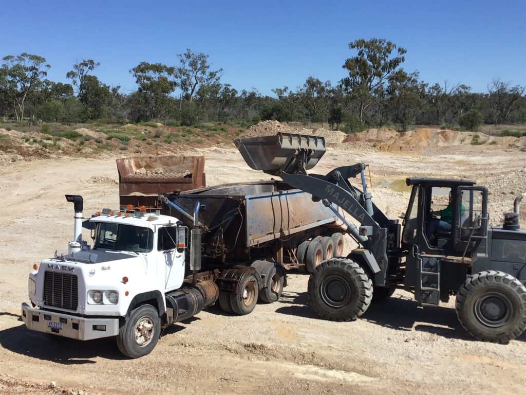 Year 6 students participating in river activities including fish measurement and water sampling