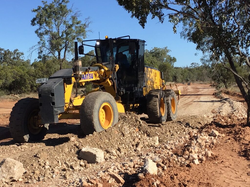 Outback red dirt road through open land — the Grawin Front Road upgrade